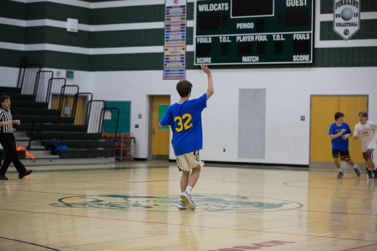 Brock Pivec playing basketball, No. 32