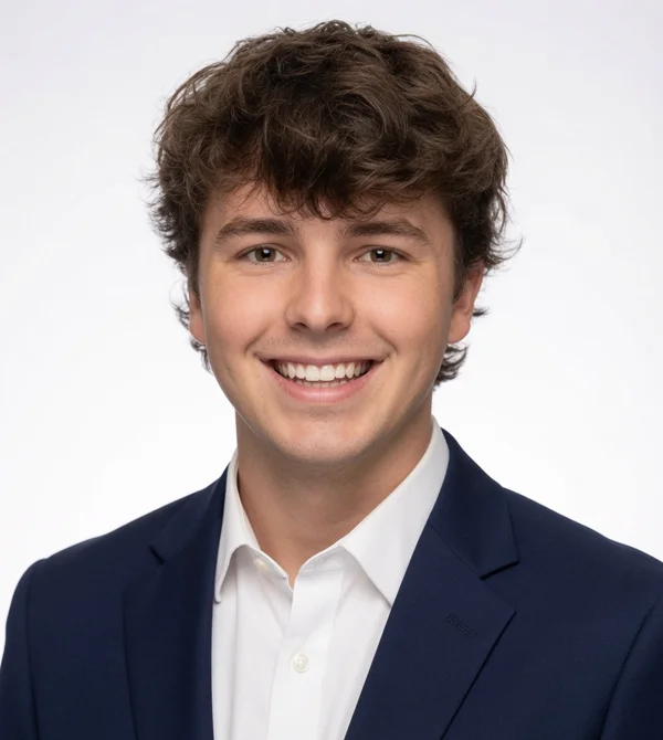 Professional headshot of Brock Pivec, navy suit, FGC Securities era