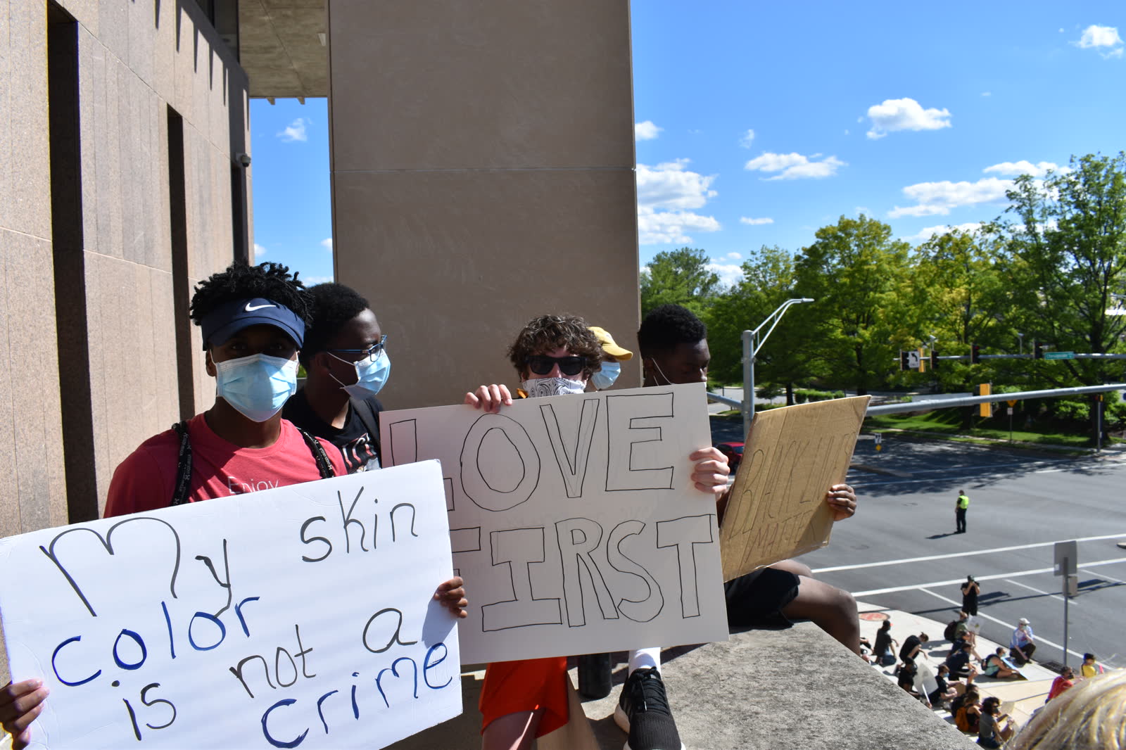 Young demonstrators holding hand-made signs